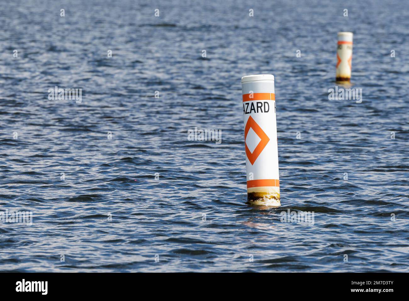 Hazard safety buoy alerting boaters to navigation danger. Nautical
