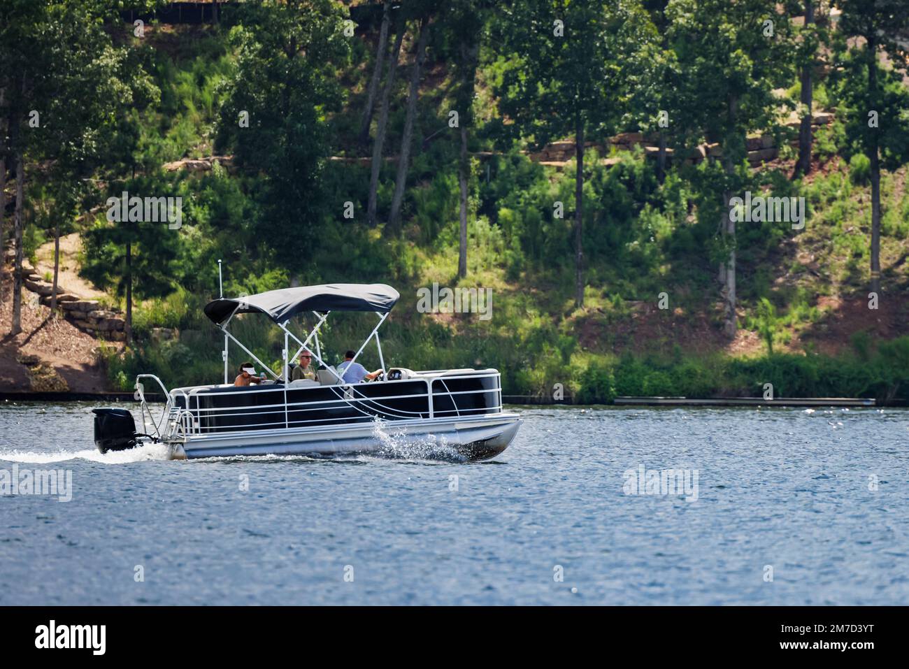 Boaters on pontoon boat enjoy summer day on Lake Oconee, Stock Photo Alamy