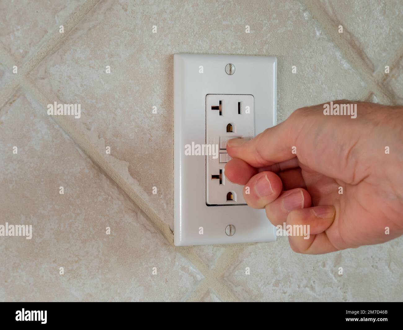 Resetting GFCI Ground Fault Interrupter Electricity Receptacle And Wall Resetting GFCI Ground Fault Interrupter Electricity Receptacle And Wall