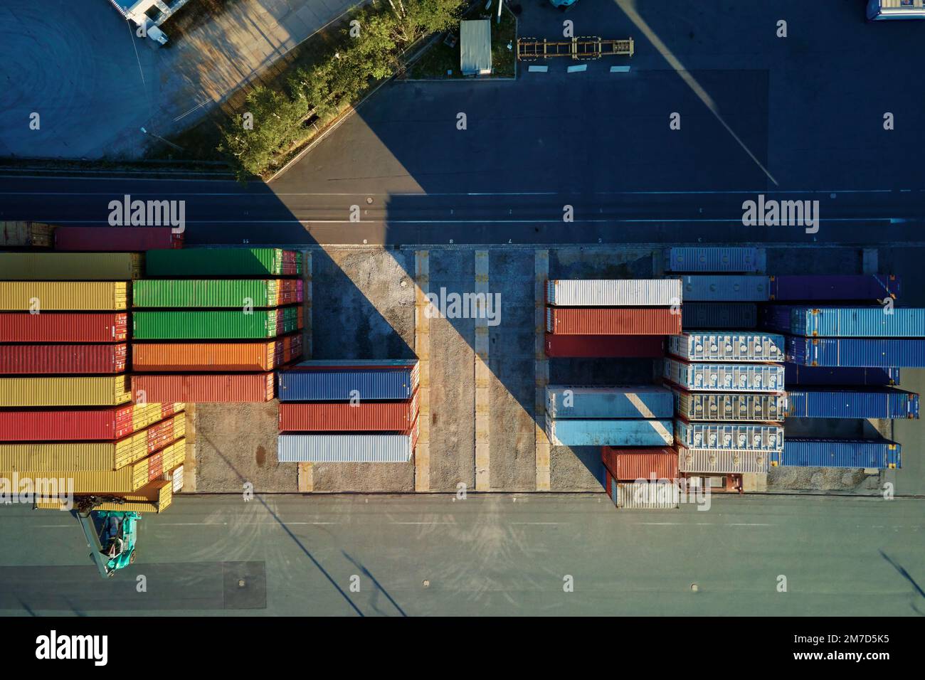 Shipping container site in warehouse storage factory, aerial view