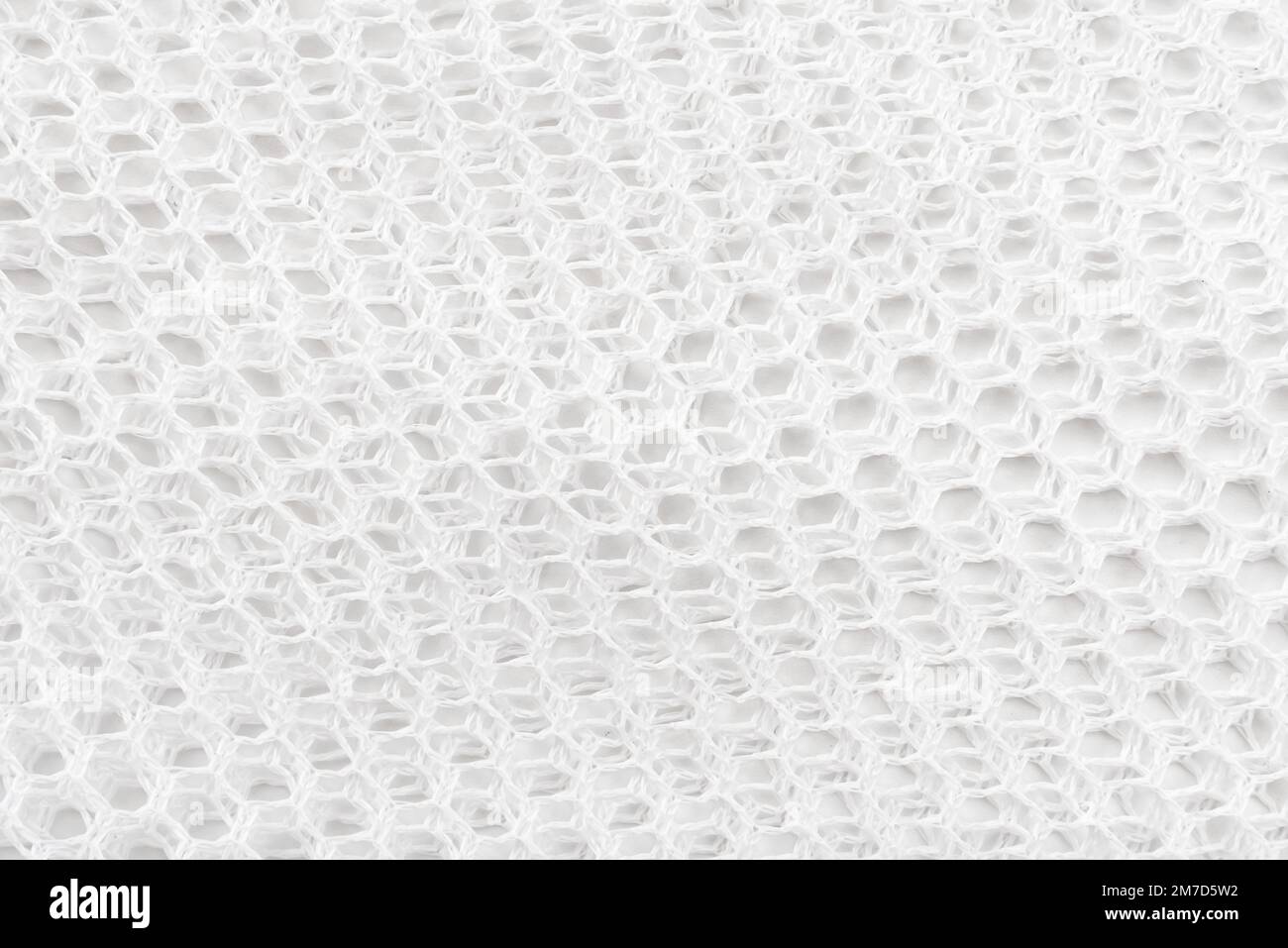 Texture or background of mesh fabric in white. Mesh material Stock