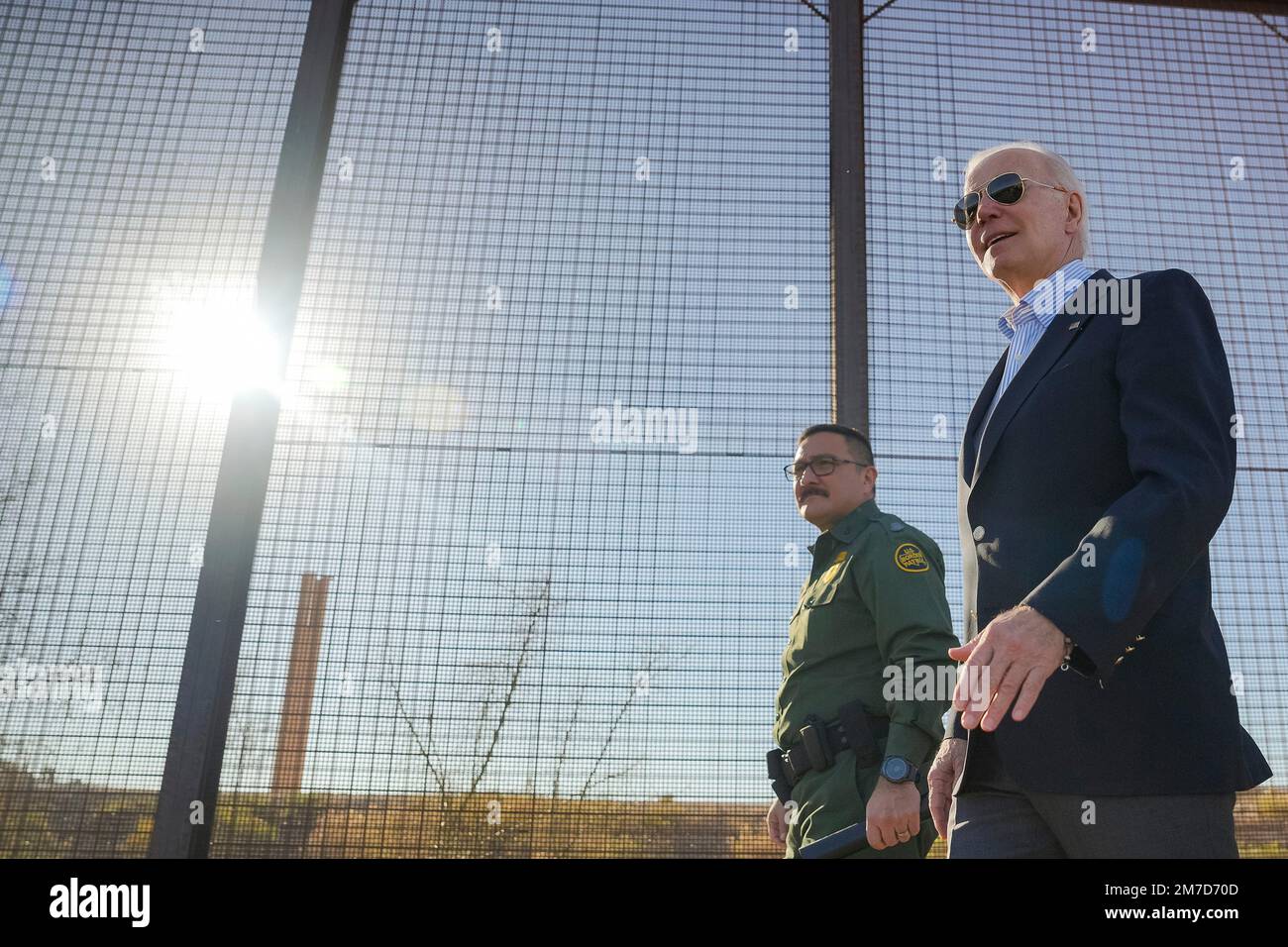 El Paso, United States of America. 08 January, 2023. U.S President Joe Biden, center, walks with Custom and Border Patrol officers during a visit to the border wall along the Rio Grande, January 8, 2023 in El Paso, Texas. Biden is in El Paso to view the southern border where migration is at a record high. Credit: Adam Schultz/White House Photo/Alamy Live News Stock Photo