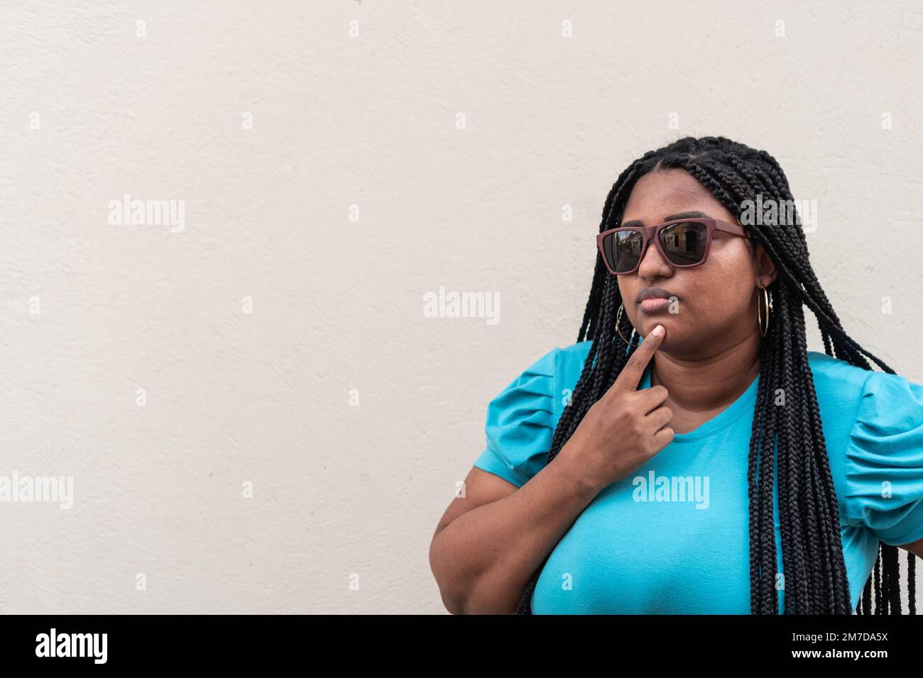 Black girl with long braids hi-res stock photography and images - Alamy
