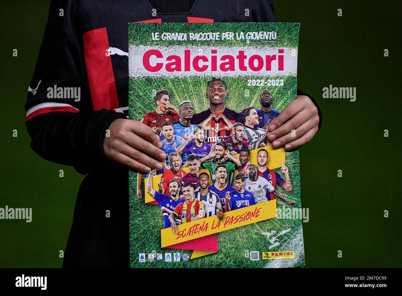 A boy holds the 2022/2023 italian edition on Panini's stickers album prior to the Serie A football match between AC Milan and AS Roma. Milan and Roma Stock Photo