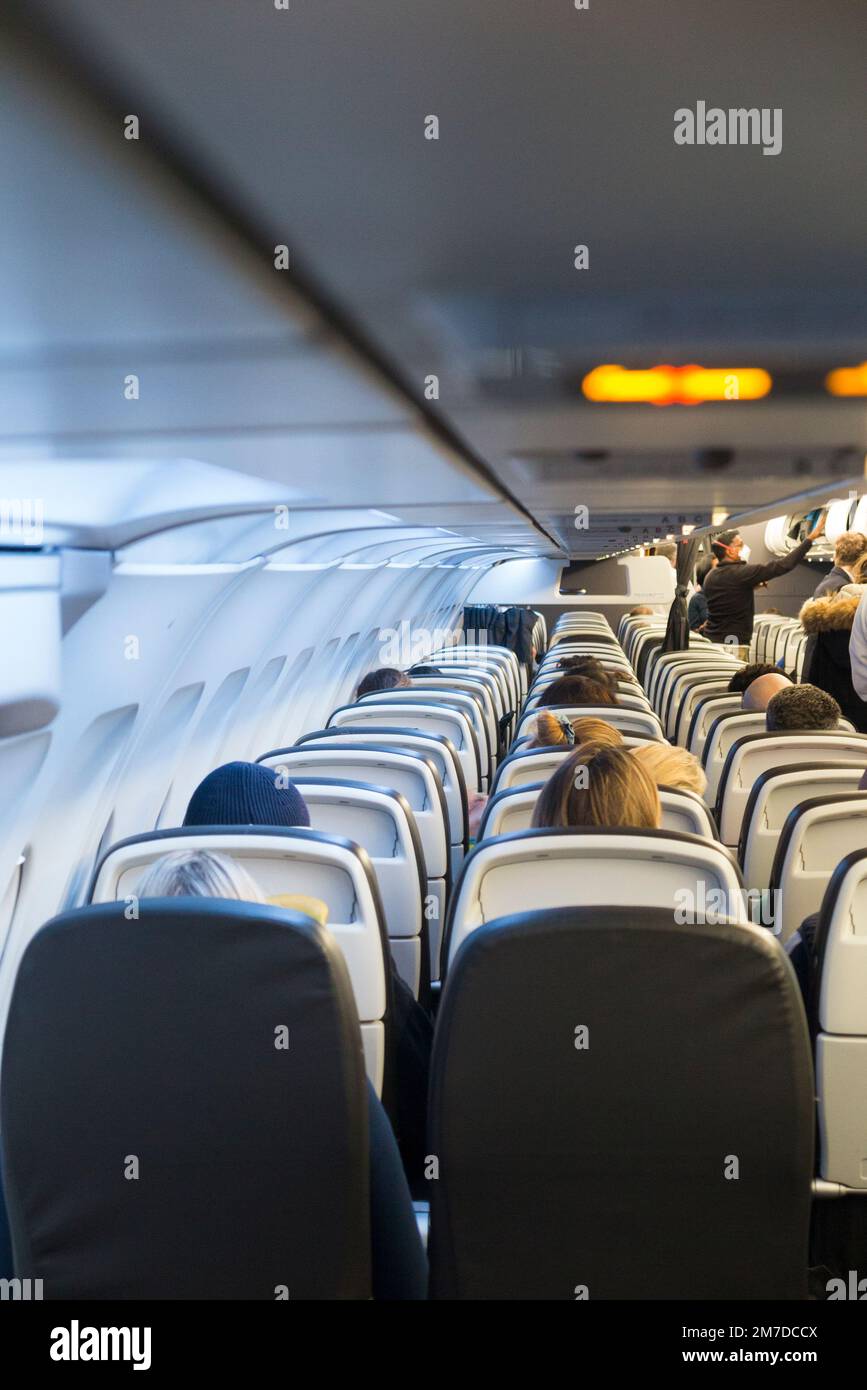 Seat backs and rows of passenger seats / seating on a BA Airbus A321 plane / airplane