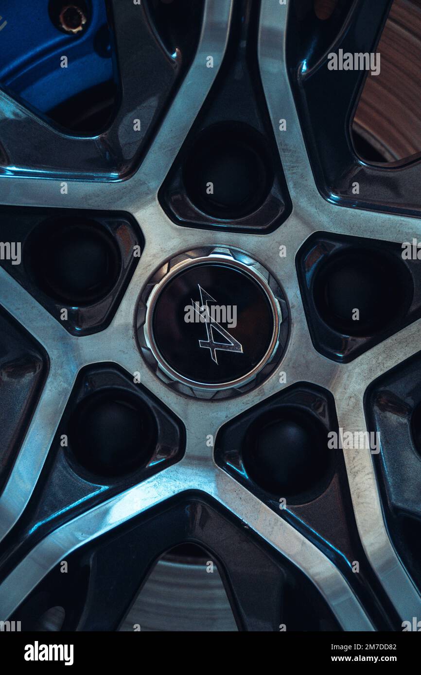 Alpine Rims Front View A vertical detailed shot of a metal wheel of an Alpine A110 sports car ...