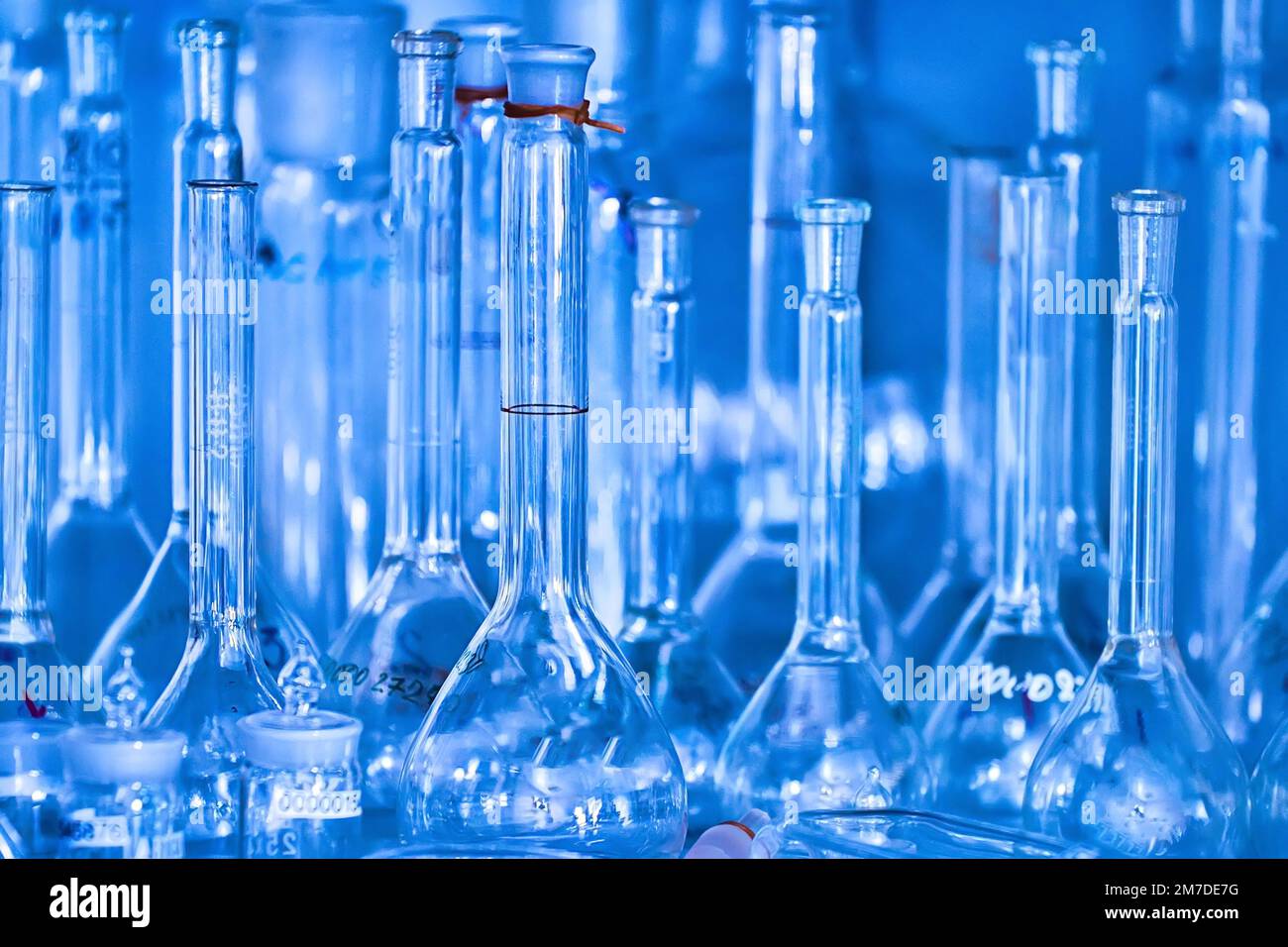 Clean empty flasks and test tubes closeup. Abstract background