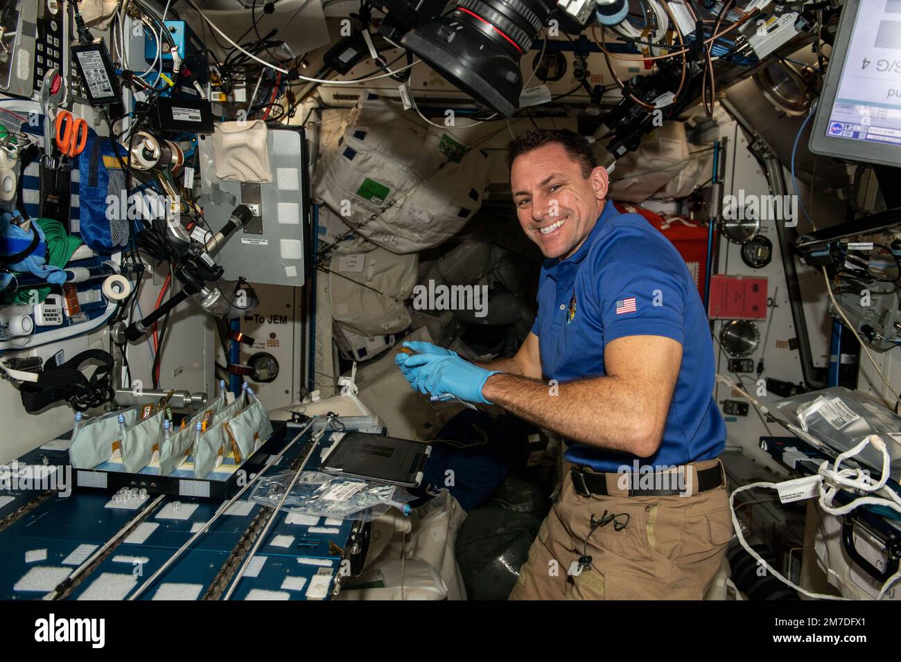 ISS - 04 January 2023 - NASA astronaut and Expedition 68 Flight Engineer Josh Cassada works in the International Space Station's Harmony module on the Stock Photo
