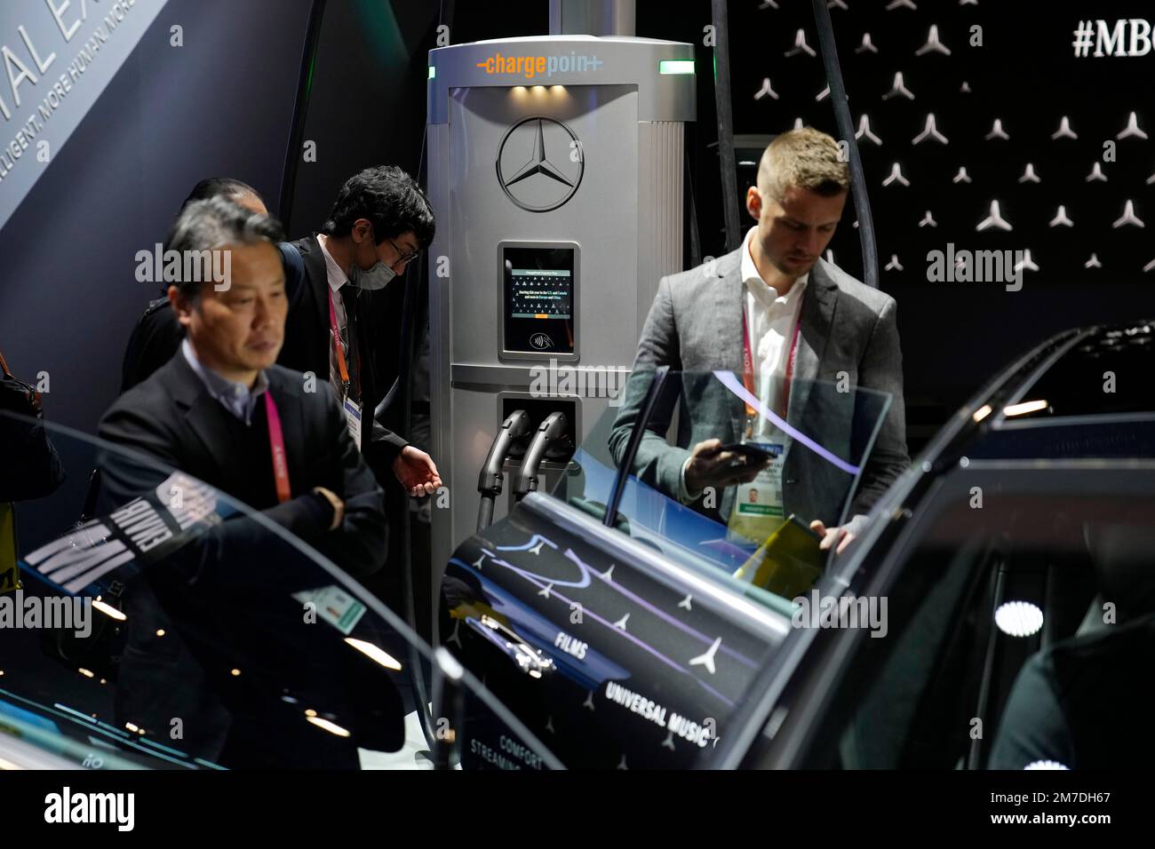 People view a ChargePoint electric vehicle charging hub at the Mercedes ...