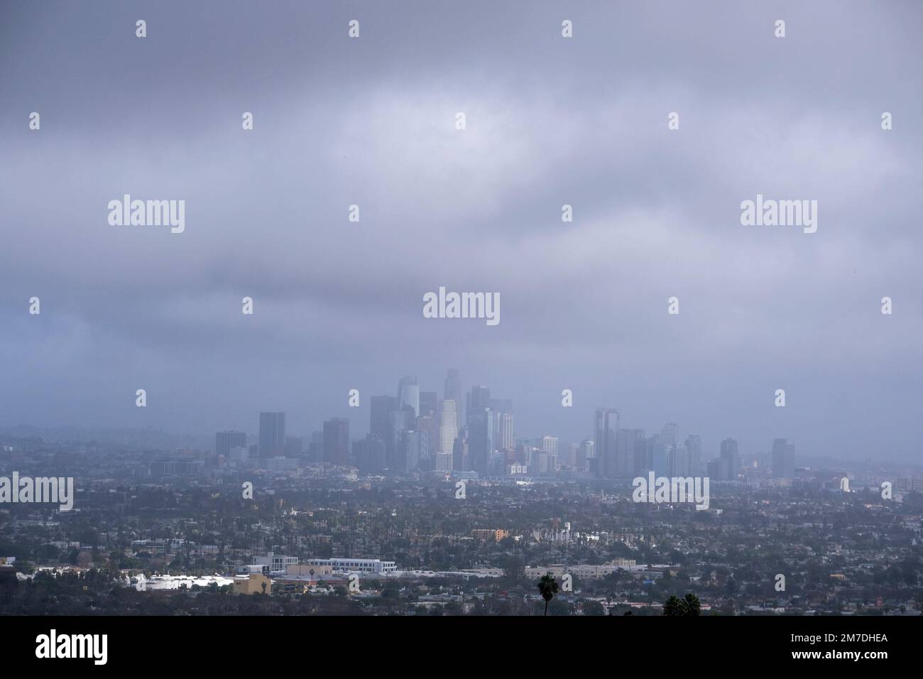Storm clouds blanket the Los Angeles skyline is seen at Kenneth Hahn ...
