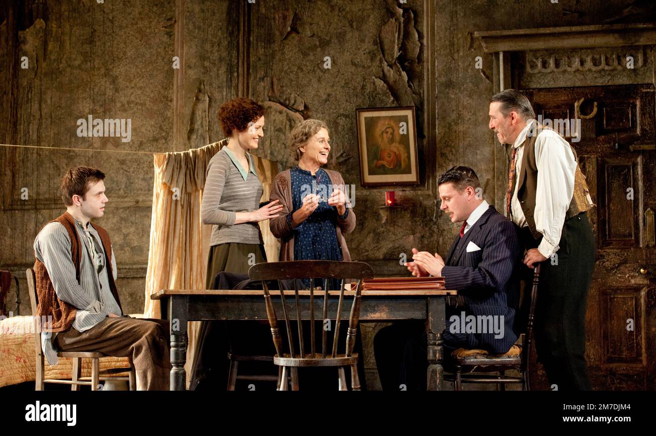 l-r: Ronan Raftery (Johnny Boyle), Clare Dunne (Mary Boyle), Sinead Cusack (Juno Boyle), Nick Lee (Charles Bentham), Ciaran Hinds (Captain Jack Boyle) in JUNO AND THE PAYCOCK by Sean O'Casey at the Lyttelton Theatre, National Theatre (NT), London SE1  16/11/2011  an Abbey Theatre Dublin & National Theatre London co-production  design: Bob Crowley  lighting: James Farncombe  director: Howard Davies Stock Photo