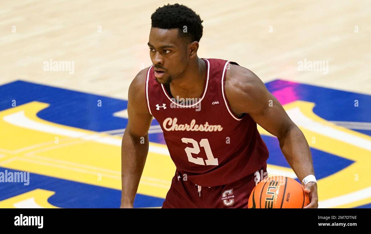 College of Charleston guard Jaylon Scott (21) brings the ball up the