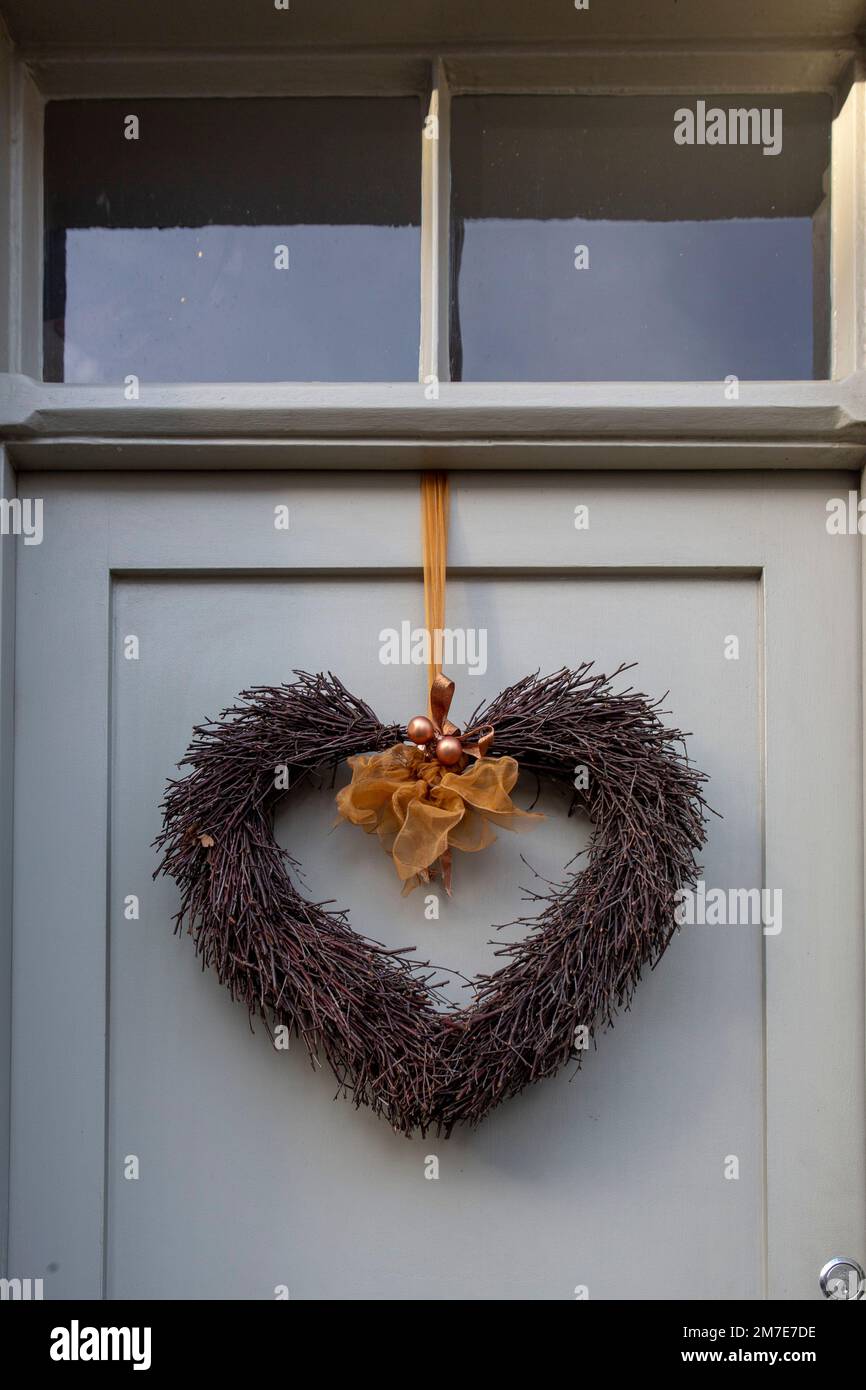 Front doors to houses at Christmas displaying festive wreaths, home made and shop bought on the doors. Stock Photo