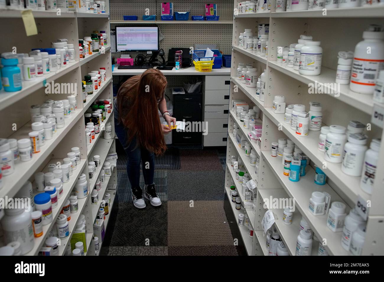 Christina McGowan fills orders at the Table Rock Pharmacy on Friday