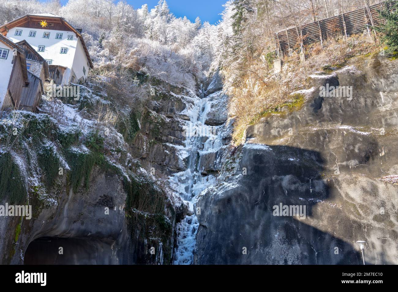 icy frozen waterfall in Hallstatt Austria winter time . Stock Photo