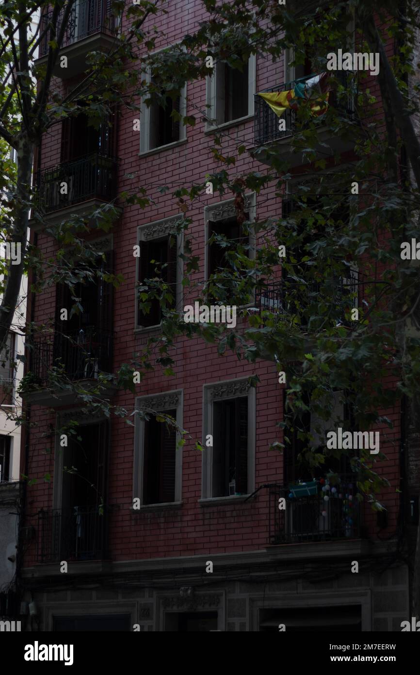A vertical shot of an apartment building with red brick wall Stock ...