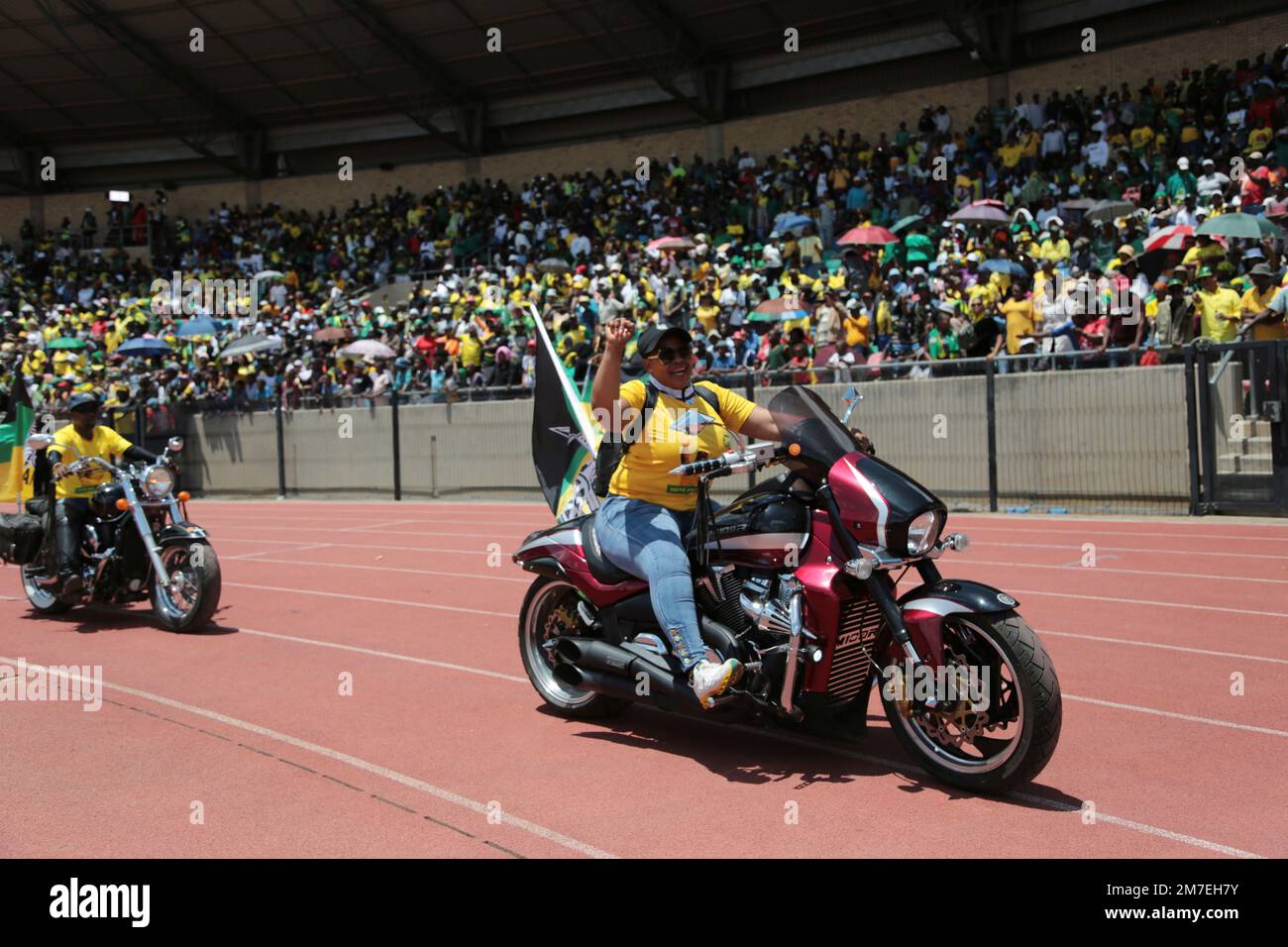 African National Congress (ANC) Party supporters parade on motorcycles as the African National Congress party celebrate its 111th anniversary, at the Dr Molemela stadium, in Mangaung, South Africa, Sunday, Jan. 8 2023. South Africa’s ruling African National Congress party on Sunday marked its 111th anniversary with celebratory events in Mangaung, Free State province, where the organization was founded in 1912. (AP Photo) Stock Photo