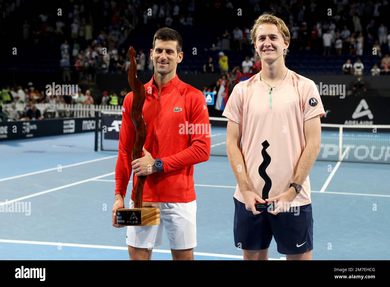 Winner Serbias Novak Djokovic and runner-up USAs Sebastian Korda pose for a photo after the final of the Adelaide International tennis tournament in Adelaide, Australia, Sunday, Jan