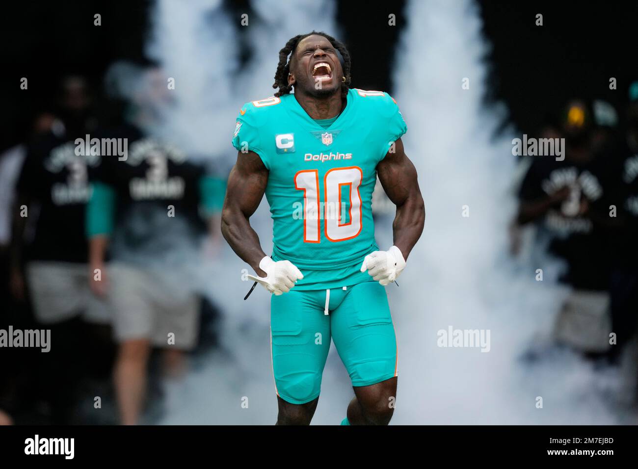Miami Dolphins wide receiver Tyreek Hill (10) reacts as he is introduced  before the first half of an NFL football game against the New York Jets,  Sunday, Jan. 8, 2023, in Miami