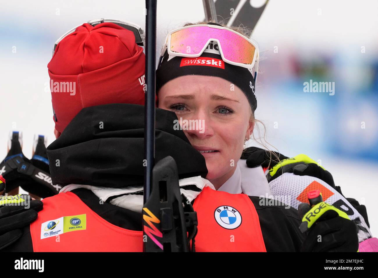 Amy Baserga hugs teammate Niklas Hartweg, of Switzerland, after