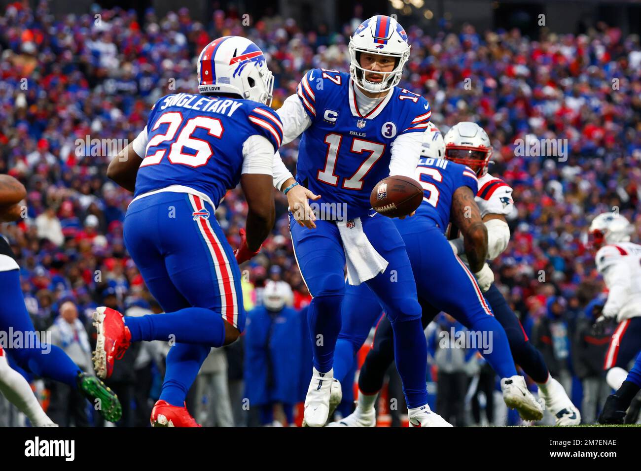 Buffalo Bills quarterback Josh Allen (17) hands off the ball to running  back Devin Singletary (26) during the first quarterof an NFL division round  football game, Sunday, Jan. 22, 2023, in Orchard