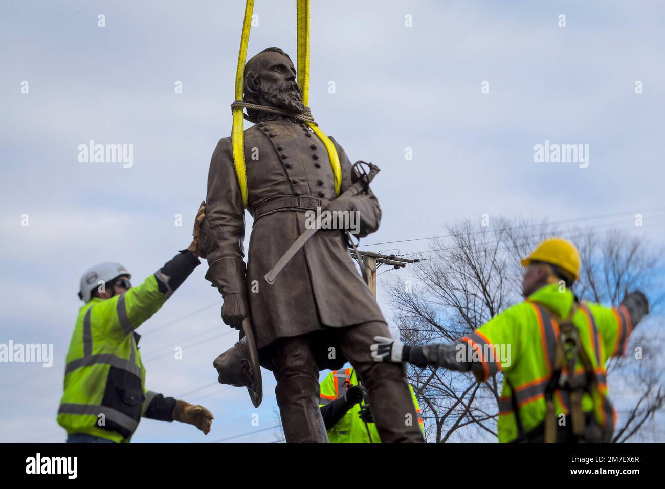 Workers begin to lay the bronze statue of Confederate General A.P. Hill