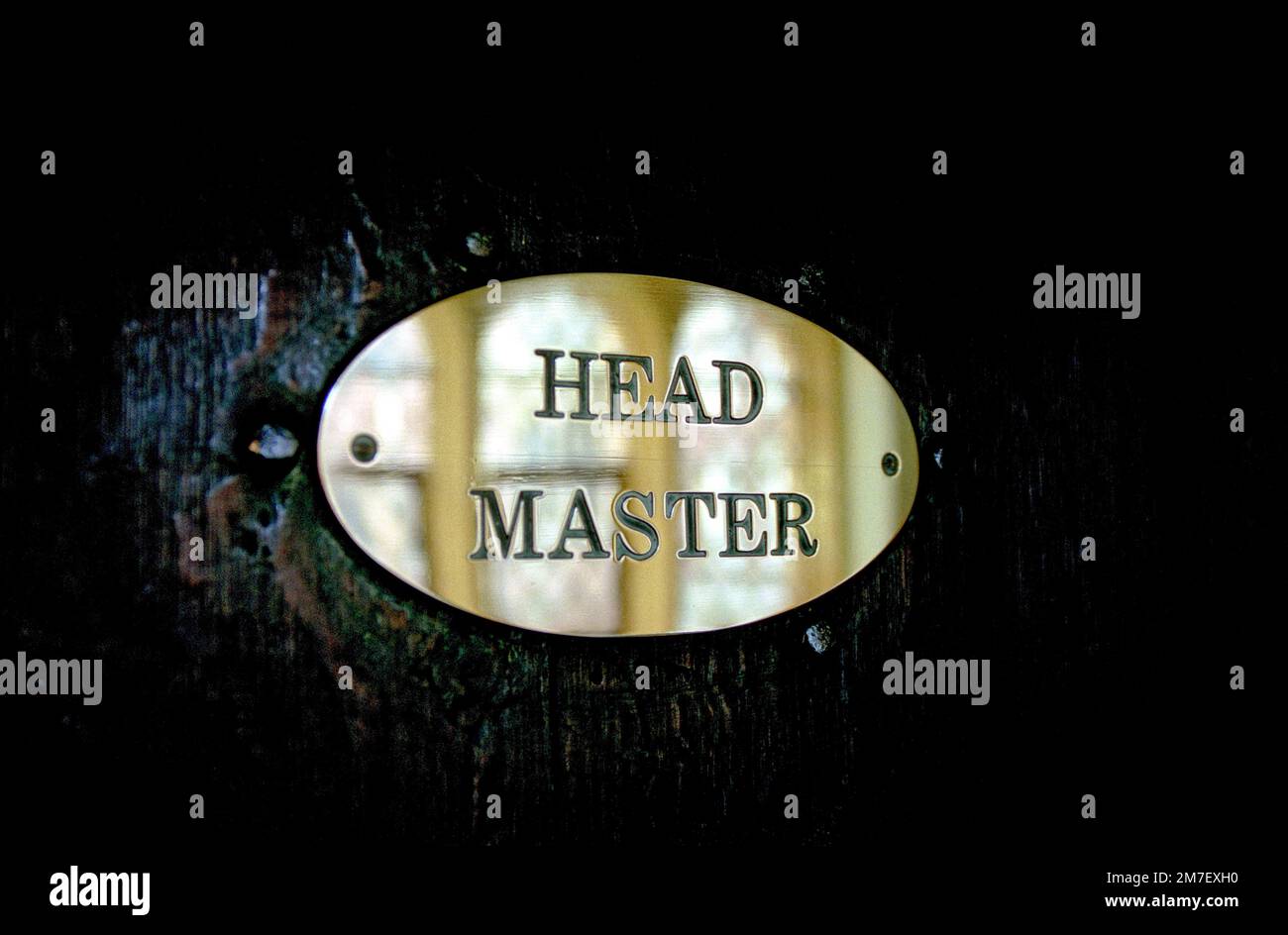 A headmaster sign or plaque on the door of his study in a private