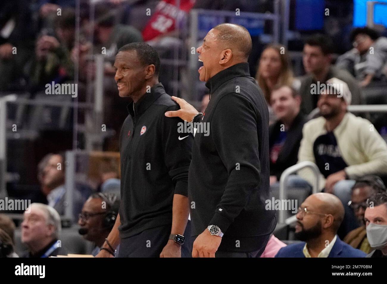 Detroit Pistons head coach Dwane Casey, left, and Philadelphia 76ers