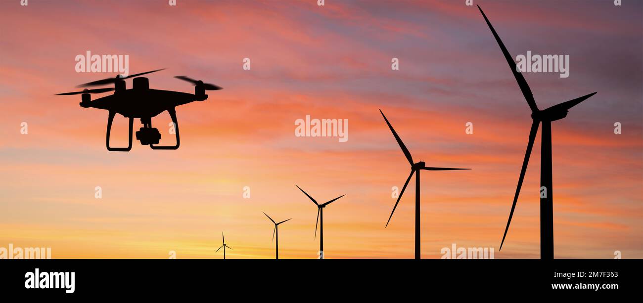 Silhouette of drone and wind turbines at sunset Stock Photo - Alamy