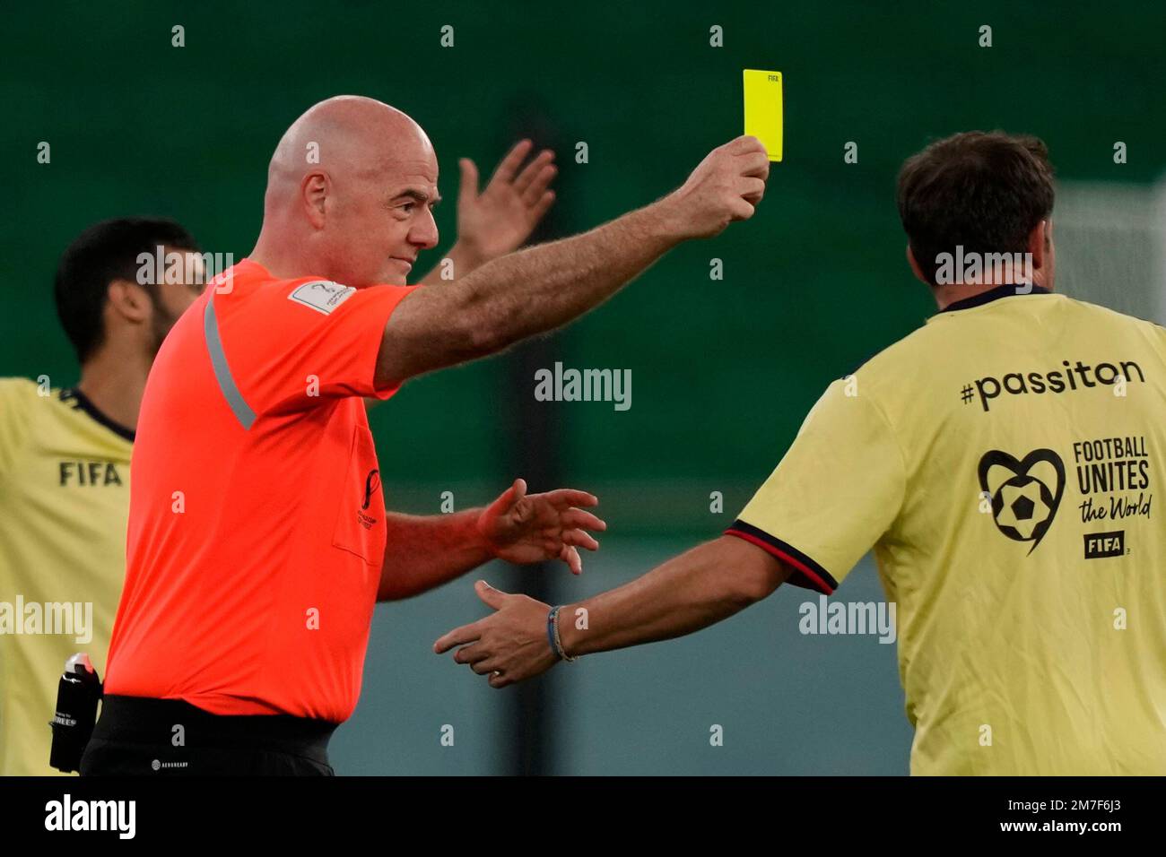 FIFA President Gianni Infantino as referee shows the yellow card to