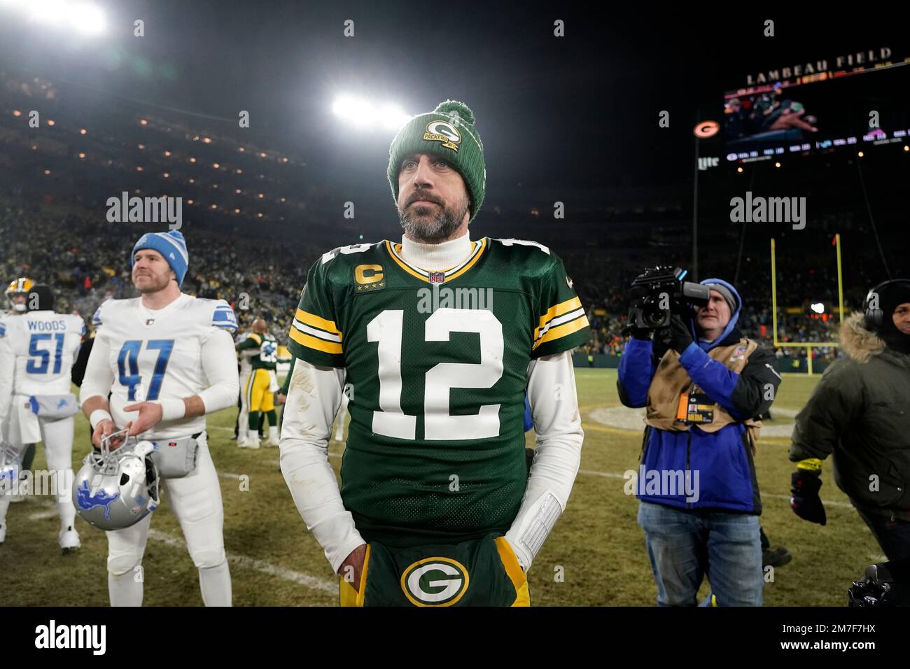 Green Bay Packers quarterback Aaron Rodgers stands on the field