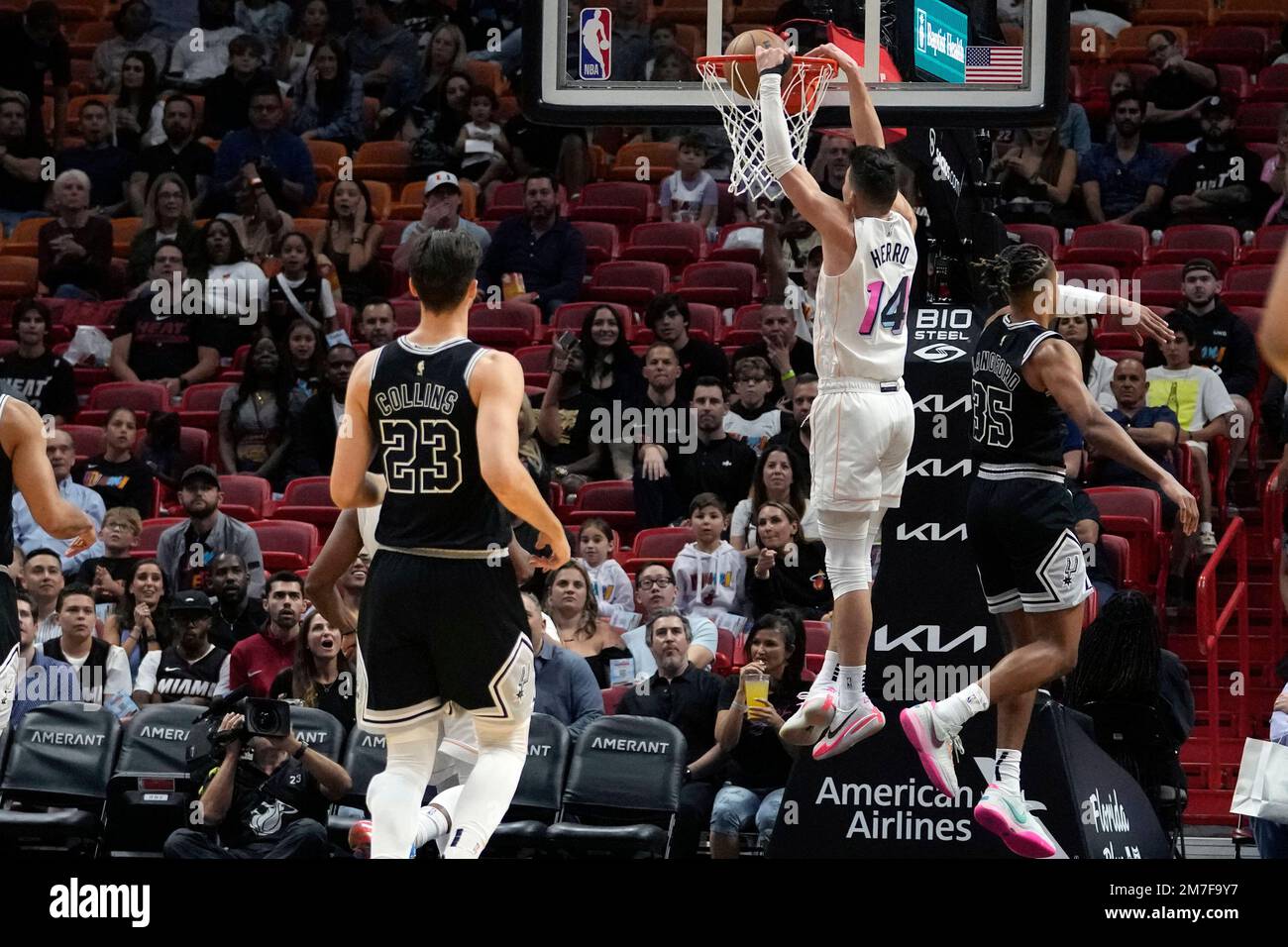 Tyler Romeo Miami Heat guard Tyler Herro (14) dunks over San Antonio Spurs guard ...