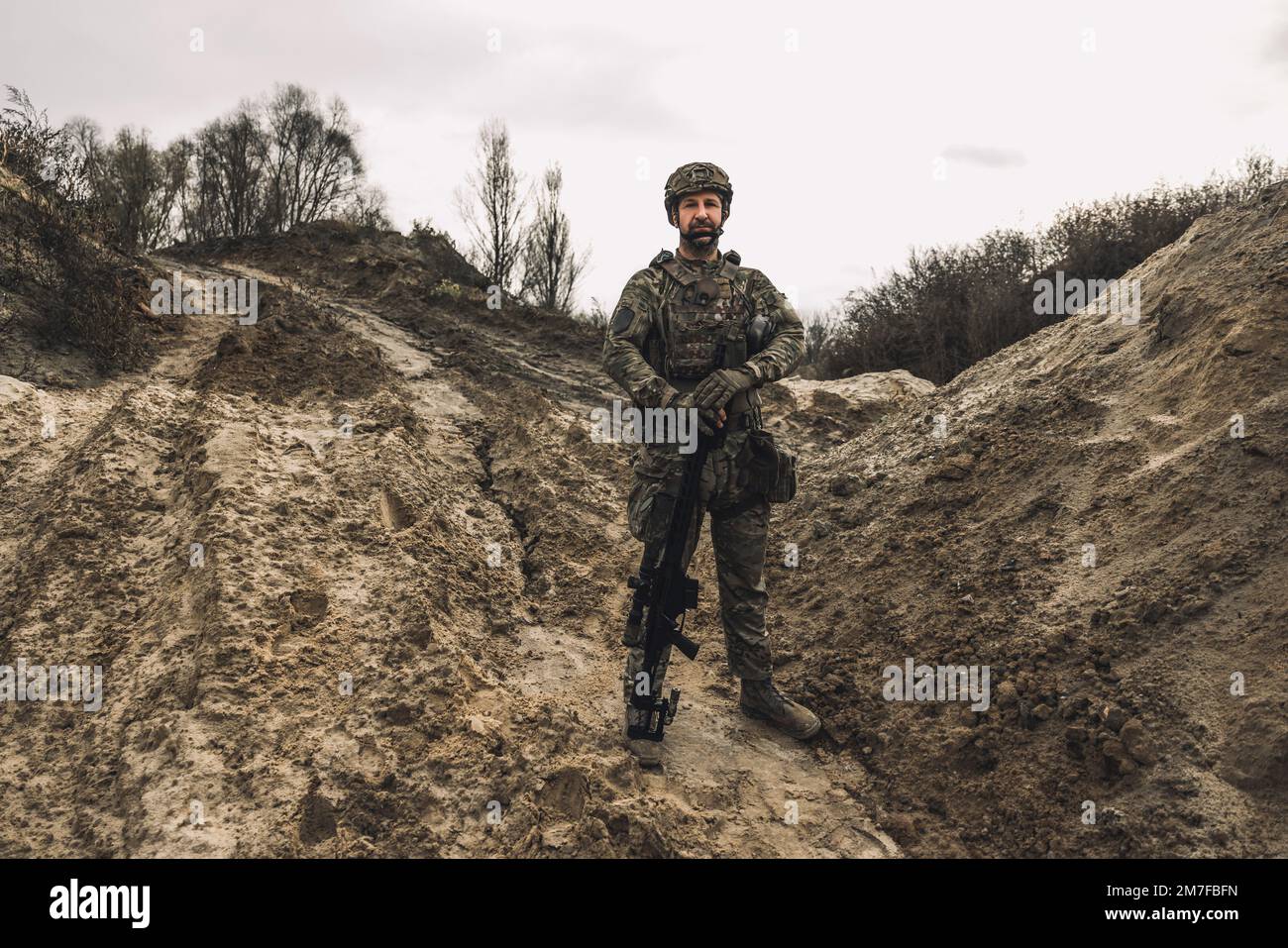 A soldier standing in a dig-position Stock Photo