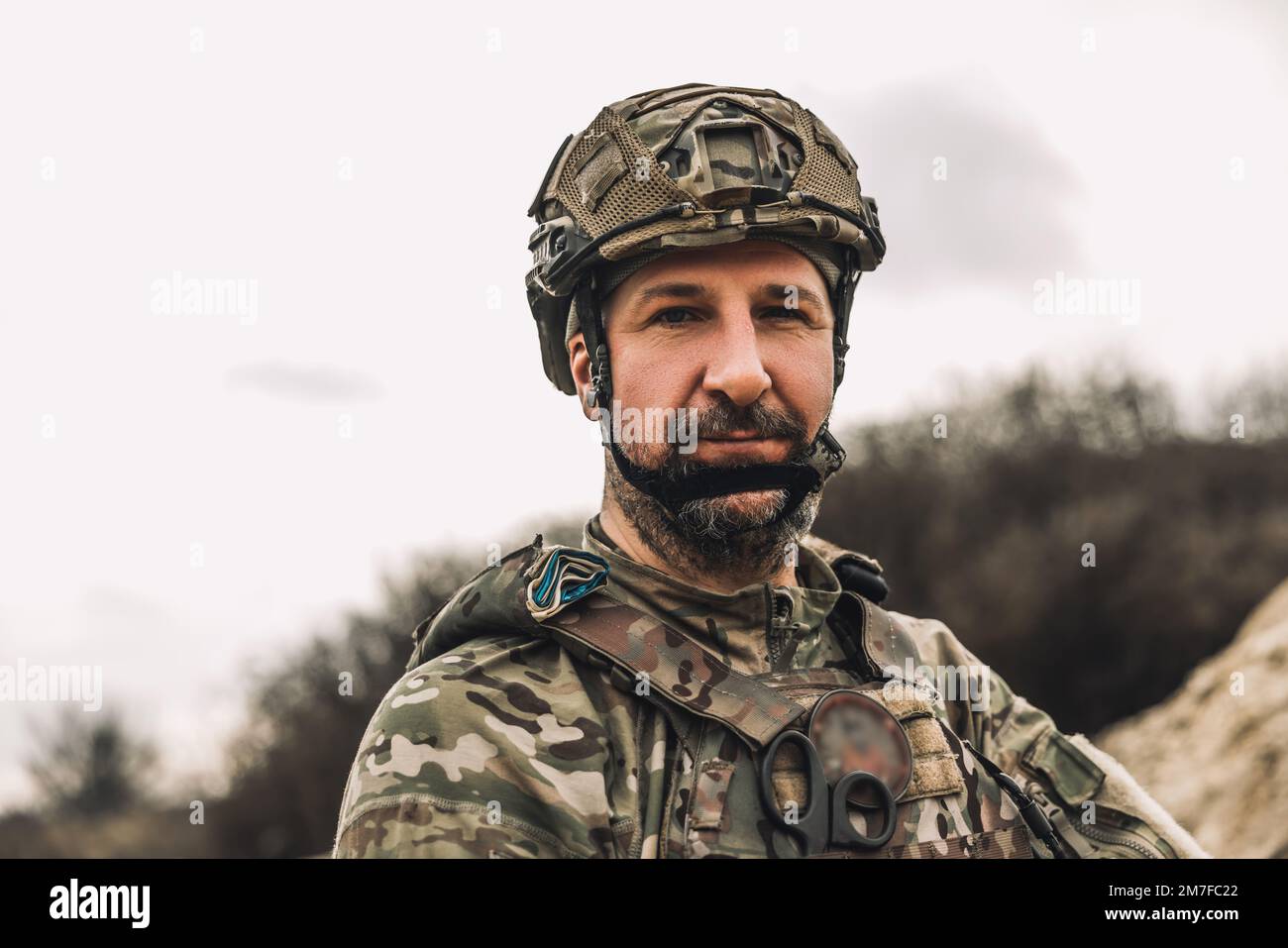 Mature man in military uniform and protective hemlet Stock Photo