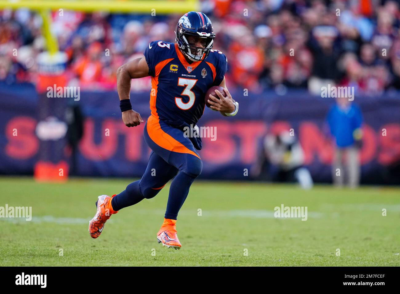 Denver Broncos quarterback Russell Wilson (3) runs against the Kansas ...