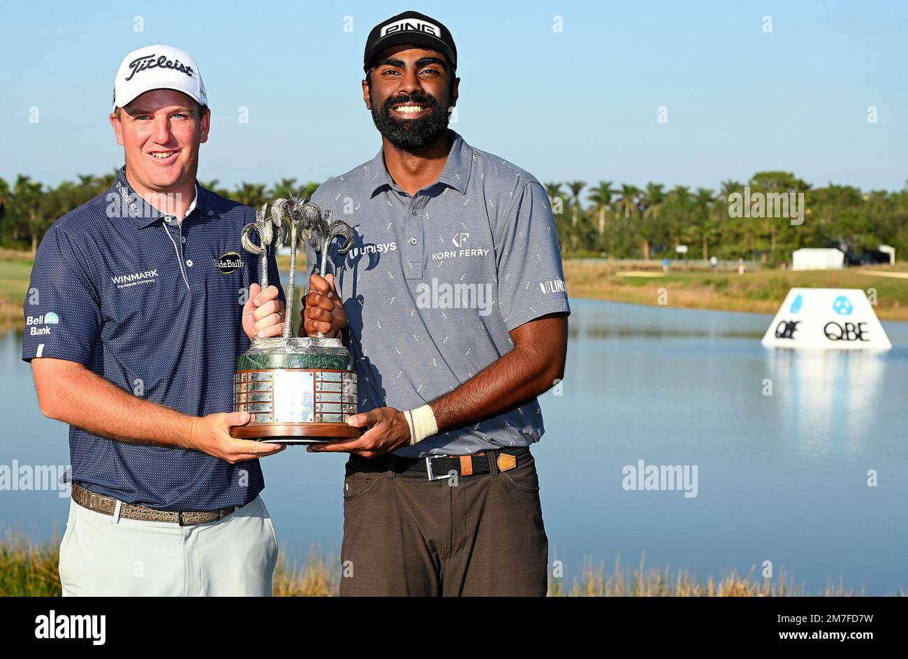 Tom Hoge and Sahith Theegala pose after winning the PGA QBE Shootout