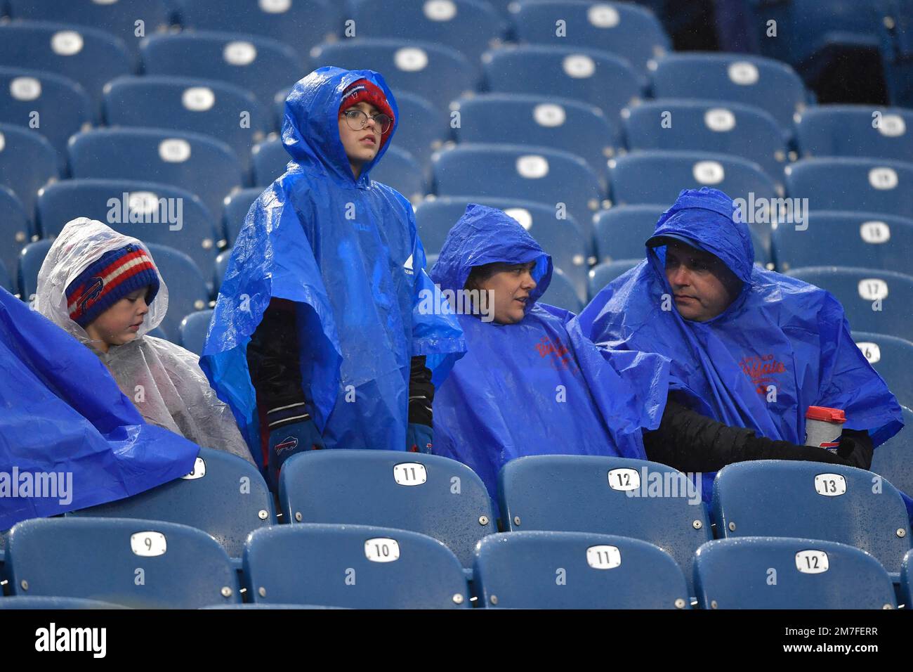 Fans wear rain gear prior to an NFL football game between the New York Jets  and the Buffalo Bills, Sunday, Dec. 11, 2022, in Orchard Park, N.Y. (AP  Photo/Adrian Kraus Stock Photo 
