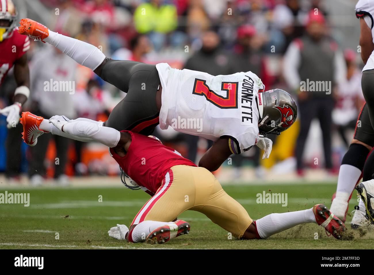 San Francisco 49ers cornerback Jimmie Ward, bottom, tackles Tampa Bay Buccaneers running back