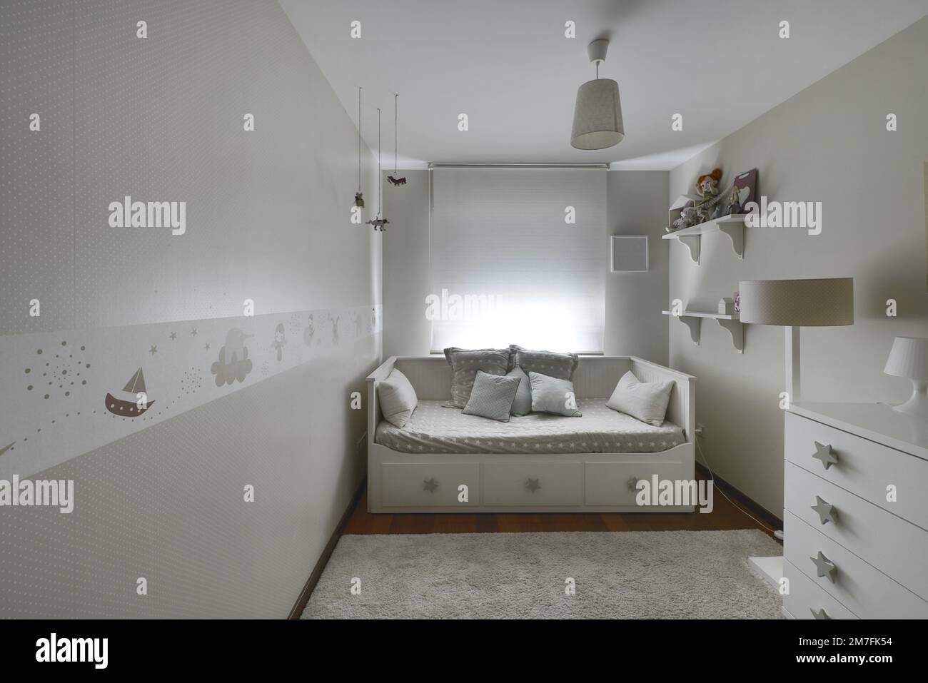 Children s bedroom with gondola sofa bed with drawers with star