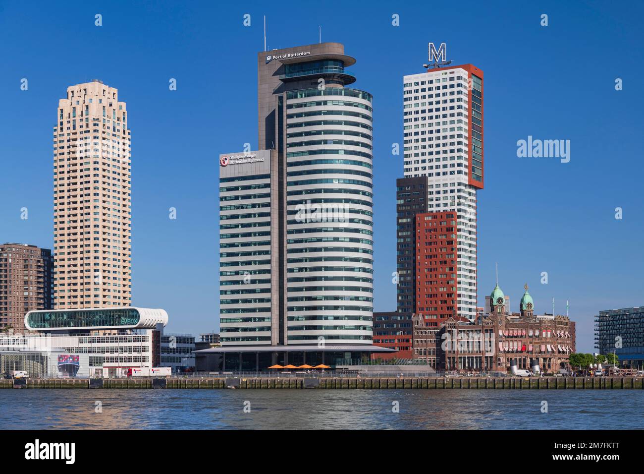 Holland, Rotterdam, The Nieuwe Maas River with the following buildings from left to right, the New Orleans Tower, the World Port Centre, the Montevideo Tower and Hotel New York which is situated in the restored former headquarters of the Holland-America Line. Stock Photo