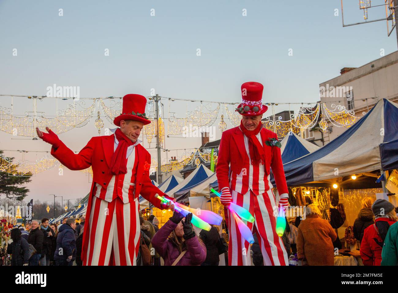 Street performer's stilt walking jugglers at the Stratford on Avon
