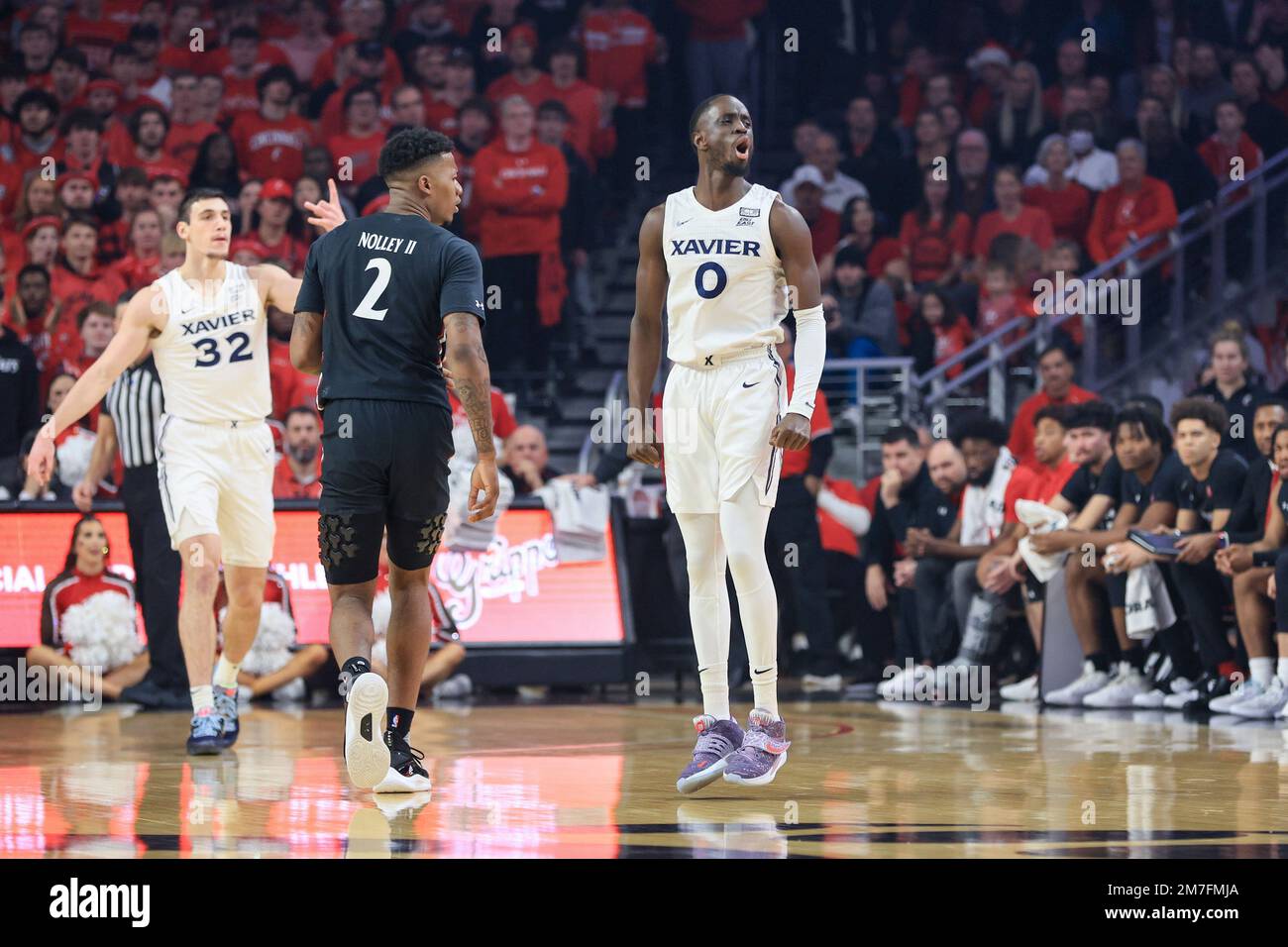 Xavier's guard Souley Boum, right, yells after making a threepoint