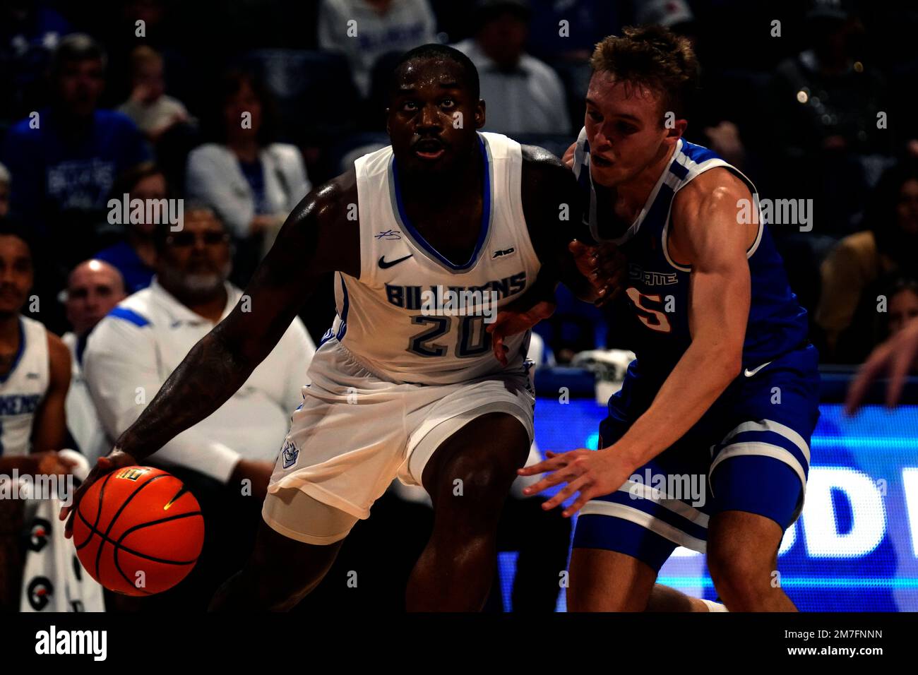Saint Louis' Fred Thatch Jr. (20) drives to the basket past Boise State
