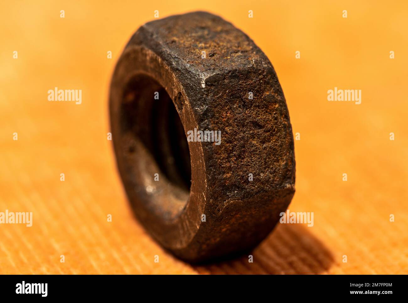 Old rusty screw nut macro close up shot Stock Photo