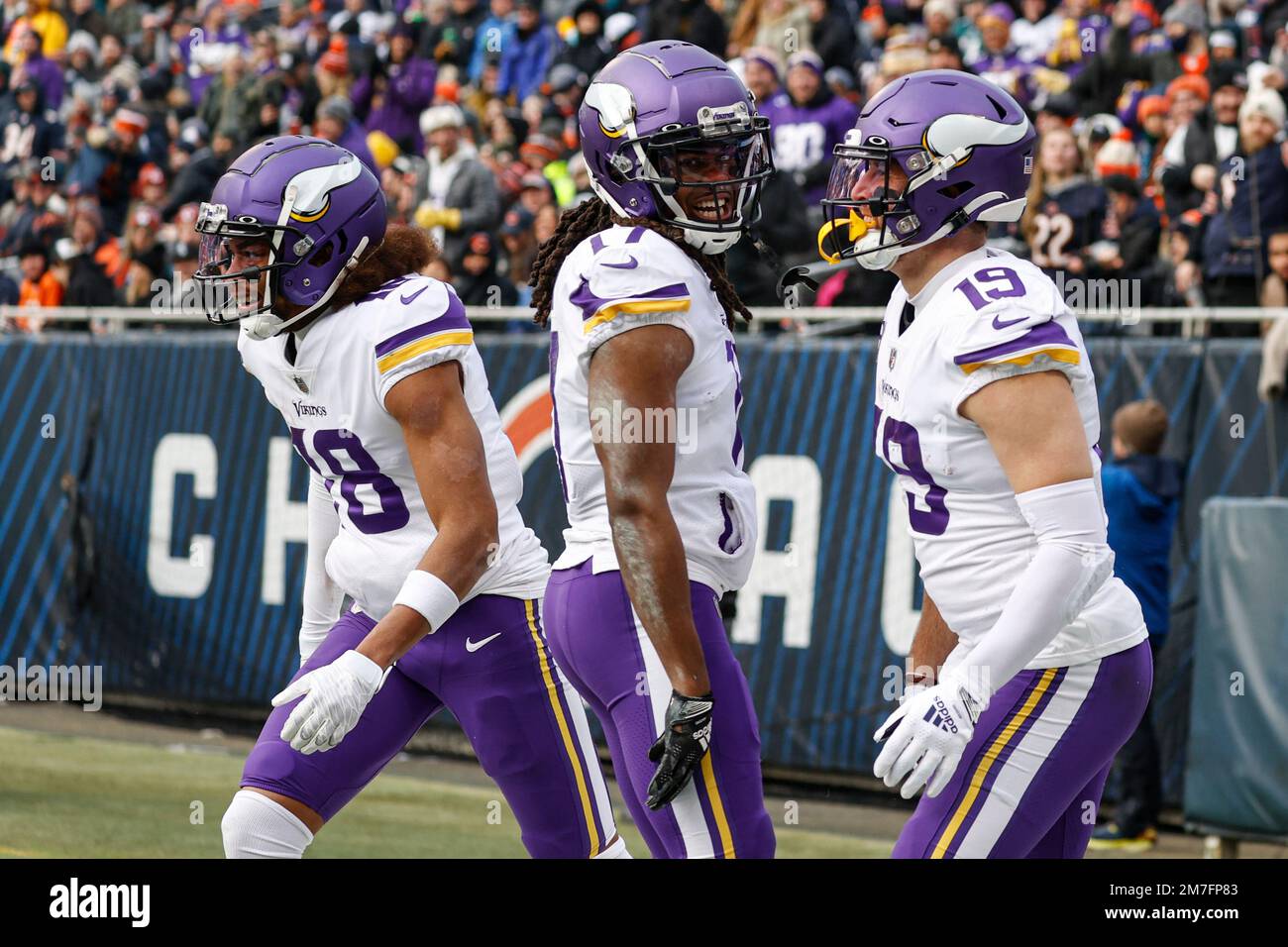 Minnesota Vikings wide receiver Adam Thielen, right, celebrates