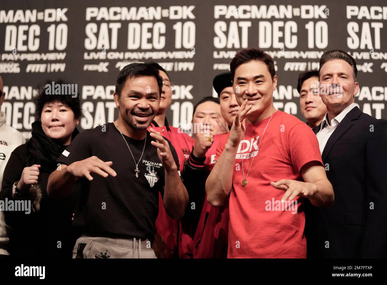 Former Filipino boxer Manny Pacquiao, center left, and South Korean martial artist D.K