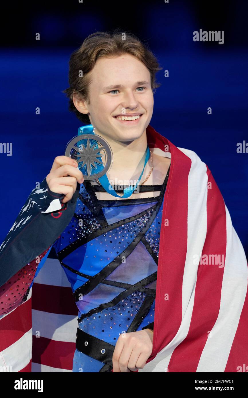 Third place United States' Ilia Malinin poses with his medal during the