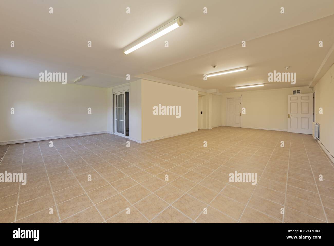 Empty Living Room Of A Ground Floor Residential Townhouse With Tiled Empty living room of a ground floor residential townhouse with tiled