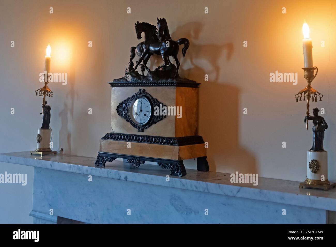 A clock and two gorgeously designed candles. Hagley Museum, Wilmington, Delaware, USA Stock Photo