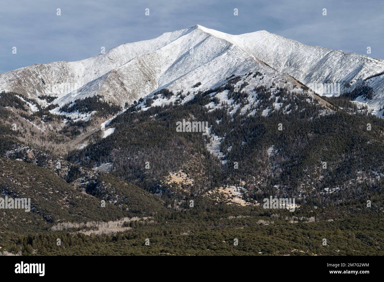 13,580 Foot Twin Peaks viewed from the San Luis Valley. Twin Peaks is part of the Sangre de Cristo Range south of the Great Sand Dunes National Park. Stock Photo